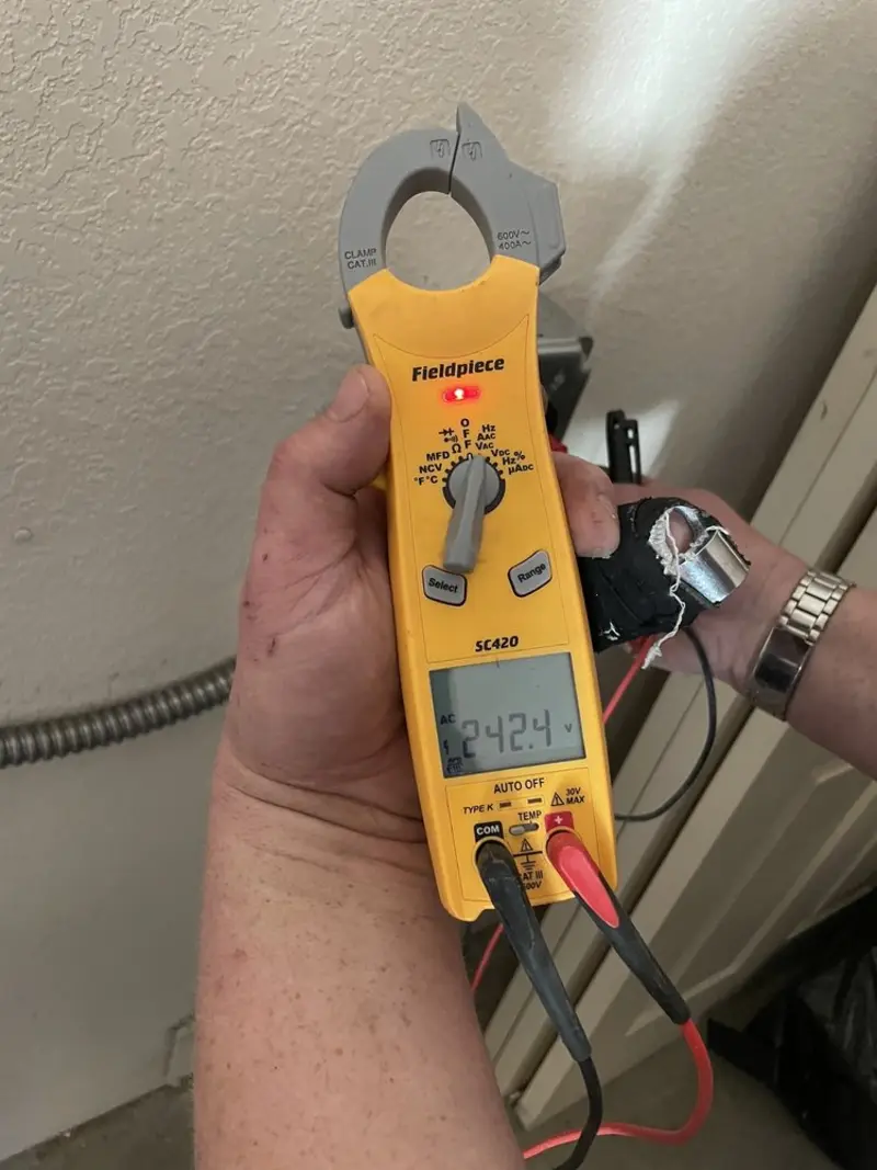 Voltage testing with clamp meter during Ceiling Fan Installation in Douglas